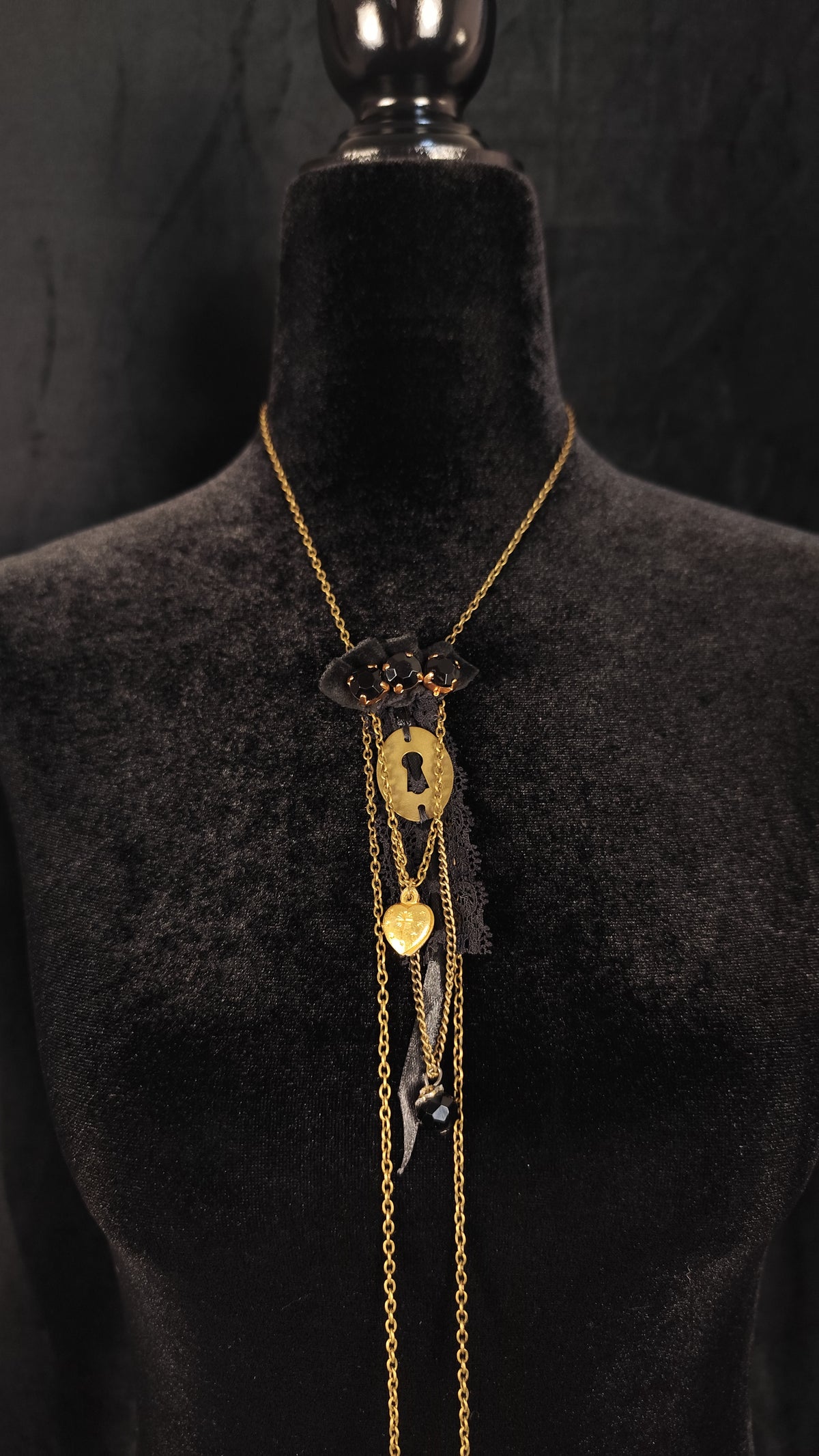 Gothic necklace with black rhinestones, golden keyhole and agnus dei heart, golden chain and satin ribbon, lace and velvet ornament.