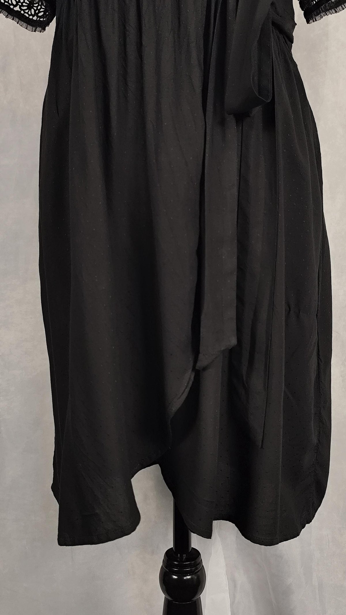 Skirt detail from an alternative black wrap dress.